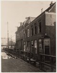 De huizen die in de Ruysdaelstraat stonden, klaar voor de sloop.
              <br/>
              Beeldbank Stadsarchief, ca 1923